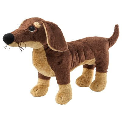 A brown and tan plush dachshund toy, crafted with polyester, featuring a soft, playful design with a friendly face and long, floppy ears.