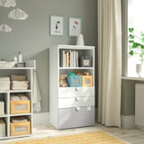Nursery with SMÅSTAD bookcase in white for toy and book storage. Gray walls, yellow rug, hanging clouds.