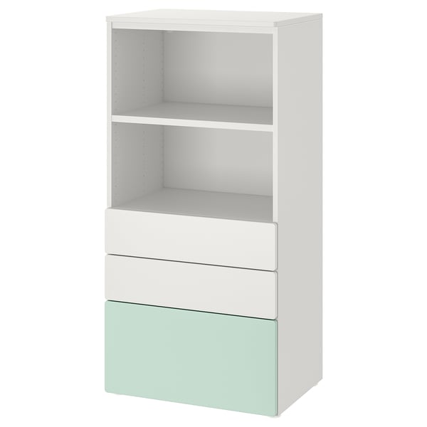 A white and light green SMÅSTAD shelving unit. It two open shelves at the top and three drawers below, made of recycled materials.