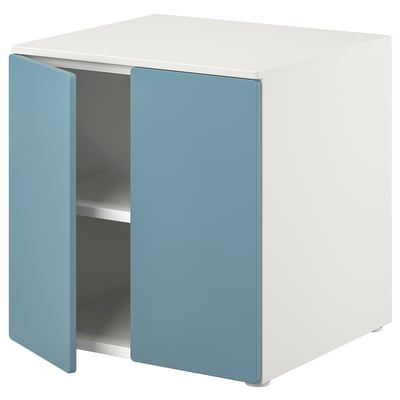 A white and blue SMÅSTAD storage cabinet with adjustable legs, designed for storing toys and books, featuring soft-close hinges.