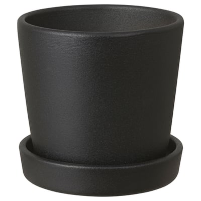 A black SMULGUBBE clay planter with a saucer. Its round, simple, and made of pigmented powder-coated red clay. Ideal for indoor or outdoor plants.