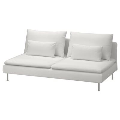 Modern white leather sofa with chrome legs and four pillows, sleek and minimalist design.