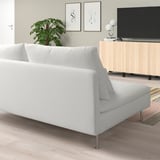 Modern white SÖDERHAMN sofa in minimalist living room with tv stand and pictures.