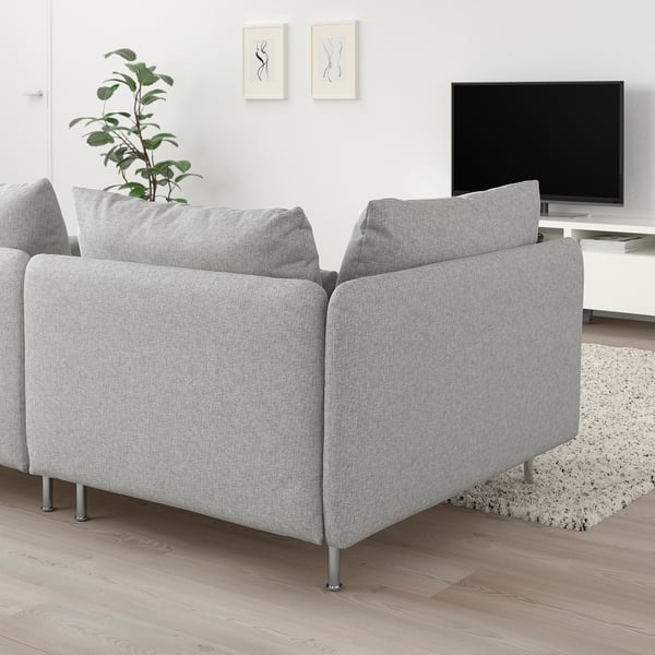 Modern living room with light gray SÖDERHAMN sectional, tv, plant, and rug.