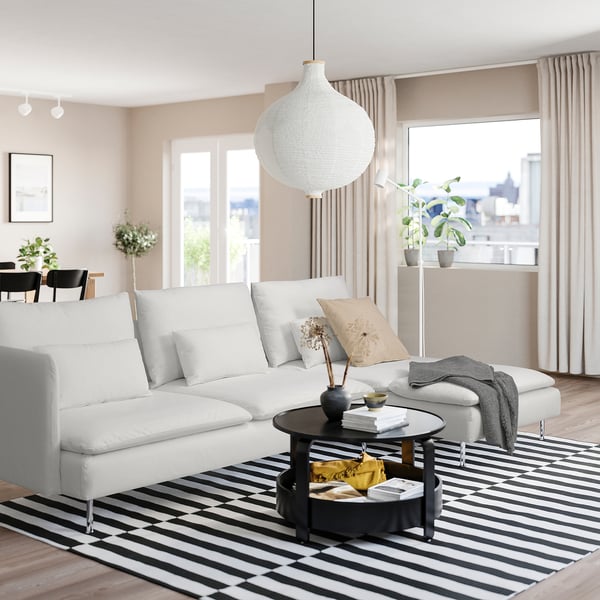 Modern living room with SÖDERHAMN sofa, coffee table, and large windows.