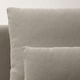 SÖDERHAMN sofa in neutral fabric close-up, displaying sleek, low-profile design and plush cushions.