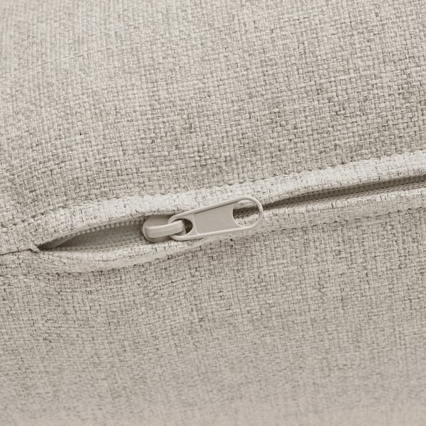 Close-up of zipper on light gray upholstered cushion, showcasing quality fabric and seamless detailing.