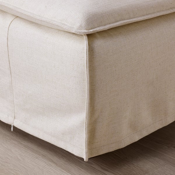 Close-up of SÖDERHAMN sofas plush, cream-colored seat. Soft, textured fabric, seams neatly finished.