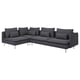 Modern black l-shaped sectional sofa with metal legs, deep cushions, and nine decorative pillows.