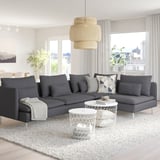 Modern living room with large grey SÖDERHAMN sectional sofa, white coffee table, and unique pendant light.