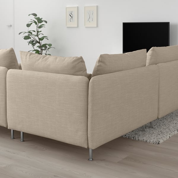 SÖDERHAMN beige sofa on wooden floor, low profile, plush cushions, large size, gray rug, tv, wall art, plant.