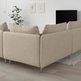 SÖDERHAMN beige sofa on wooden floor, low profile, plush cushions, large size, gray rug, tv, wall art, plant.