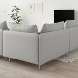 SÖDERHAMN white grey sofa, modern low profile, spacious cushions, sleek metal legs, large tv, plant, minimalist art, cozy rug, bright airy room.