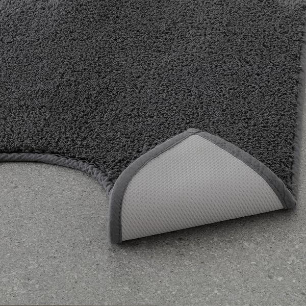 Gray pedestal mat with thick cotton pile, providing warmth and comfort near toilets. Machine washable, with latex backing for stability.