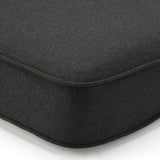 Black cushion corner with detailed stitching, showcasing quality and comfort.