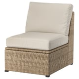 SOLLERÖN: modern beige wicker patio chair with cushions.