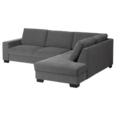 Modern gray l-shaped sofa with minimalist design, dark oak legs, and plush cushions.