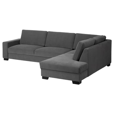 Dark gray, modern, l-shaped sofa with minimalist design, sturdy wood legs, plush cushions.