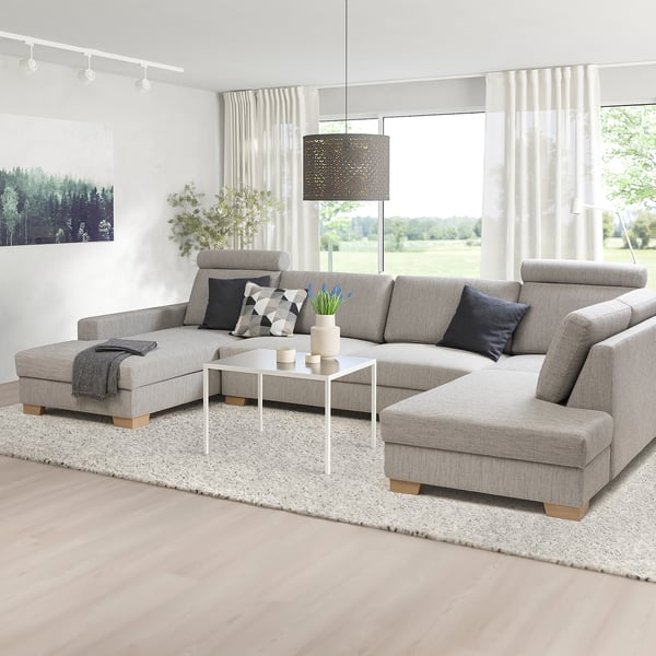 Modern gray SÖRVALLEN sectional sofa with chaise, stylish decor in bright living room.