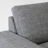 Close-up of a modern sofas arm and backrest, showcasing its sleek design and plush cushions.