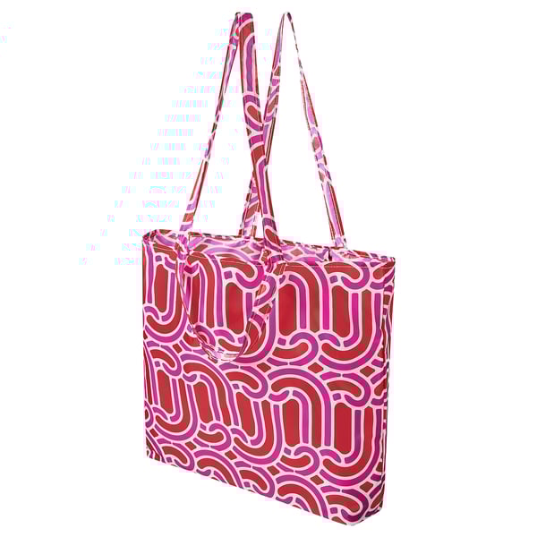 Bright pink and red patterned tote bag with white design, long handles, rectangular shape. Made from 100% recycled polyester.