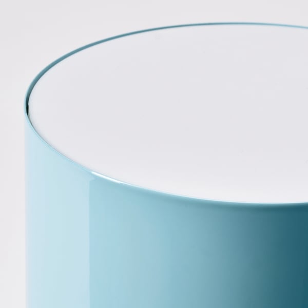 Modern turquoise table lamp with smooth, curved design. Soft touch, high-quality finish. Elegant and functional.
