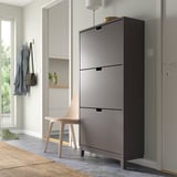 Gray STÄLL shoe cabinet near door, modern decor.