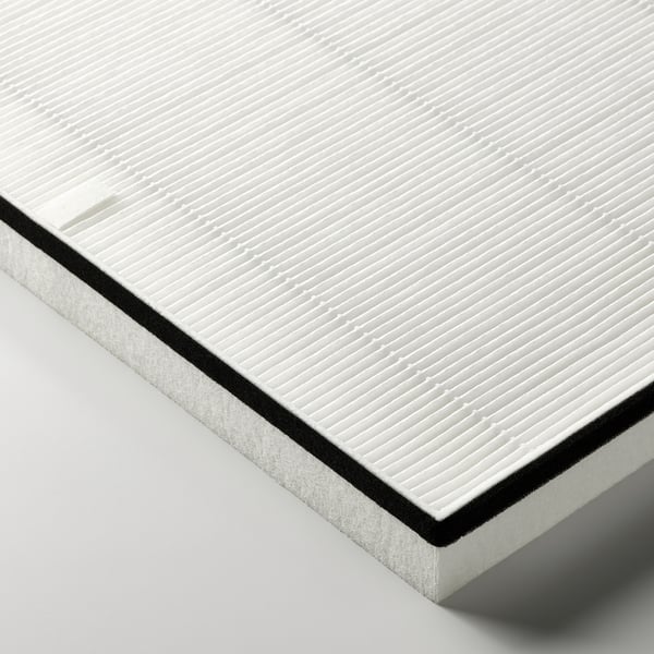 White rectangular air filter with textured surface, black border on edge, suggesting quality and efficiency in particle removal.