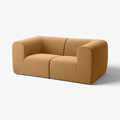 Stylish beige stockholm sofa, curved edges, plush velvet, 25-yr warranty.