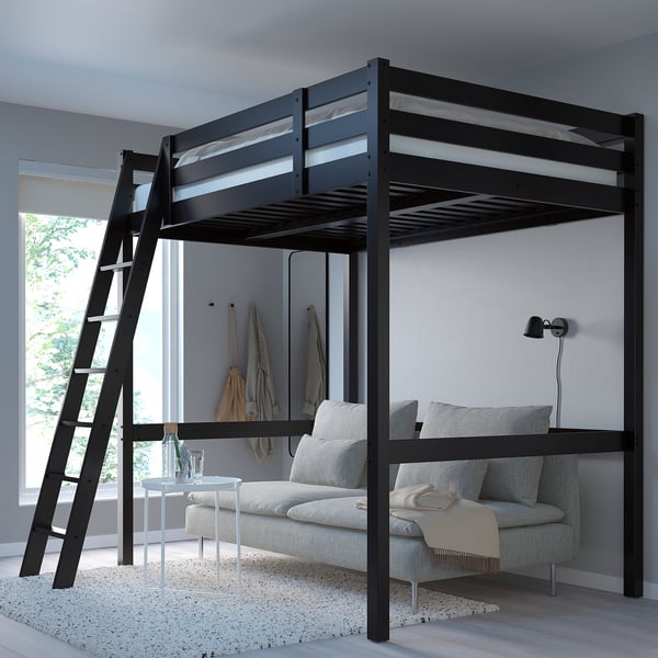 Black STORÅ loft bed, pine wood, upper bed for space saving, ladder on side, fits over large couch.