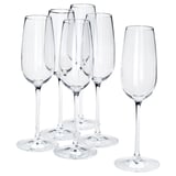 Six clear STORSINT crystal wine glasses, five grouped, one separate. Long stems, broad bowls, shiny, elegant design.