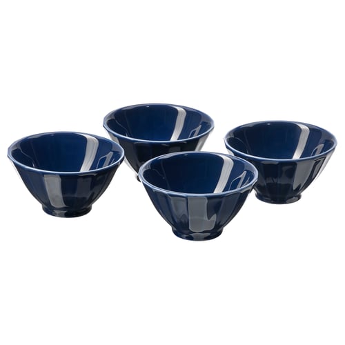 Four dark blue ceramic bowls, round and shallow, arranged in a square, featuring subtle floral patterns.