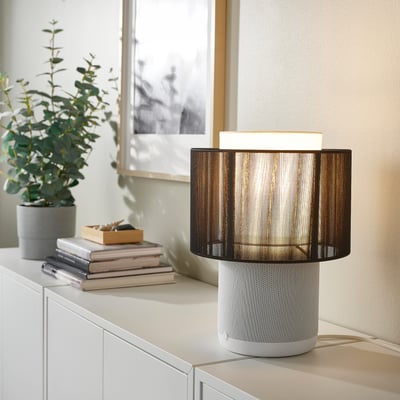 IKEA SYMFONISK wifi white speaker lamp with black shade, cylindrical.