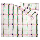 Bright pink and green checkered duvet set with yellow and blue squares on white background, soft and recycled materials.