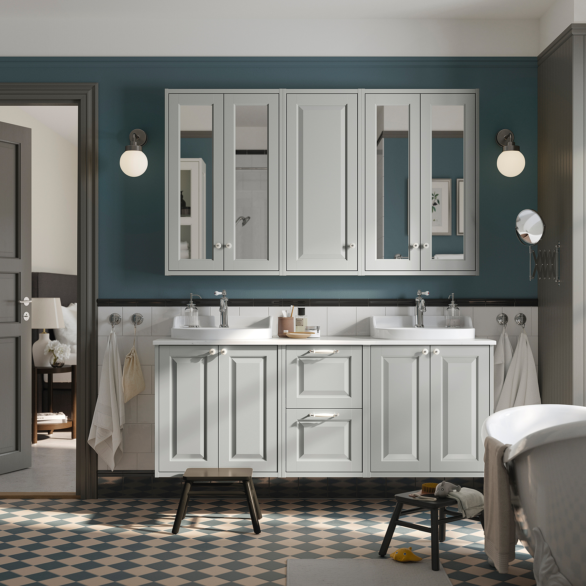 Modern bathroom with large TÄNNFORSEN white vanity, double sinks, grey walls. Checkered floor, round mirrors.
