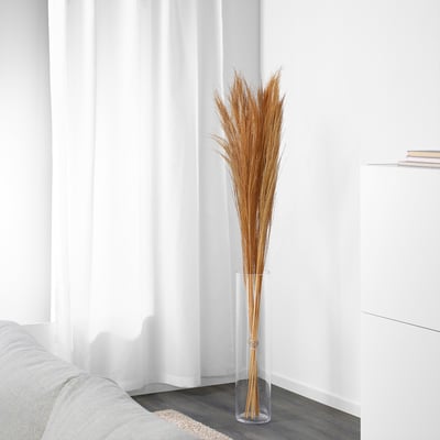 Large TORKA vase with dried twigs near white curtains.