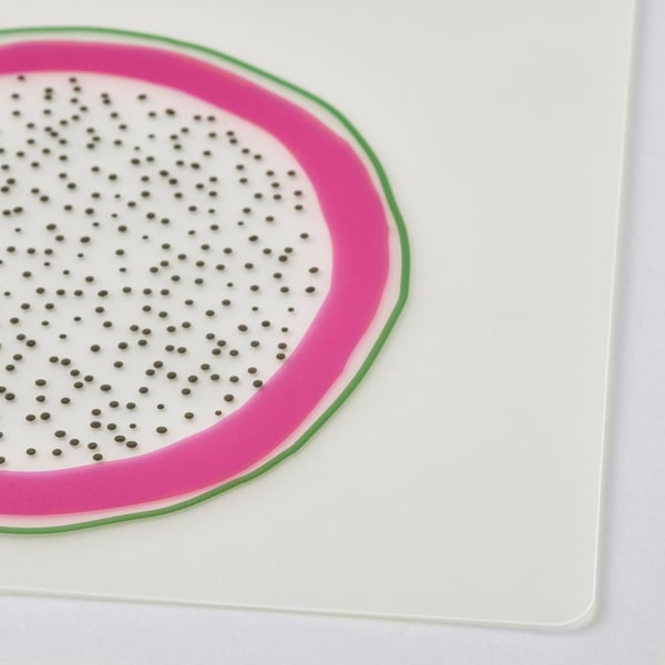 Bright place mat, watermelon design with dots, on clean white surface, durable plastic.