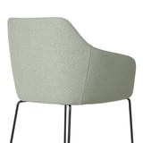 Modern upholstered chair with high back and armrests, offering comfort and support. Light gray fabric over sturdy metal legs.