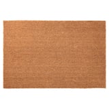 A rectangular brown TRAMPA doormat made of coir and jute, designed to be durable and easy to clean.