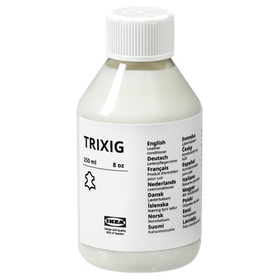 Leather conditioner in white bottle with multi-language labels.