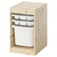 A TROFAST storage unit, light wood, with three white trays and one large white bin. It has a rectangular shape and an open front design.
