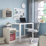 TROFAST white desk with laptop and storage in blue room