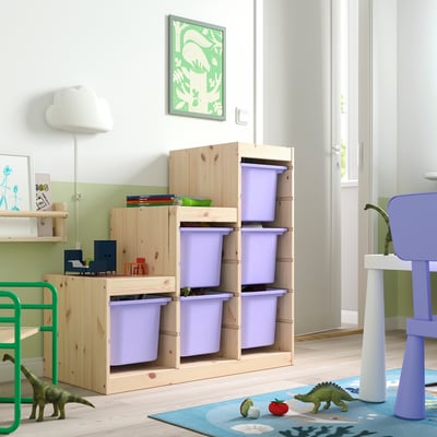 Kids room TROFAST lavender storage. Wood frame, purple plastic bins. Dinosaur toys nearby.