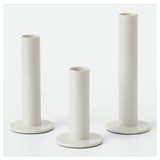 Three white TUVKORNELL candle holders, cylindrical, varying heights, in eva foam, by hagberg siblings.