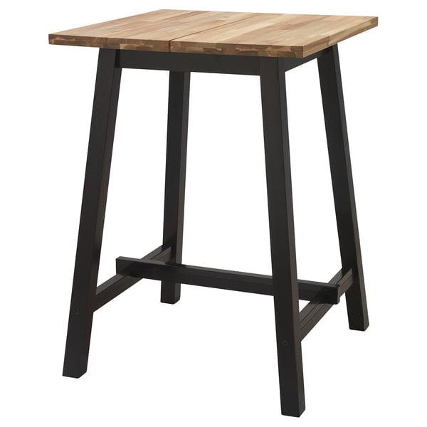 The TYBYN table a light brown acacia wood top and black metal legs, offering a sleek, modern design ideal for durability and heavy use.
