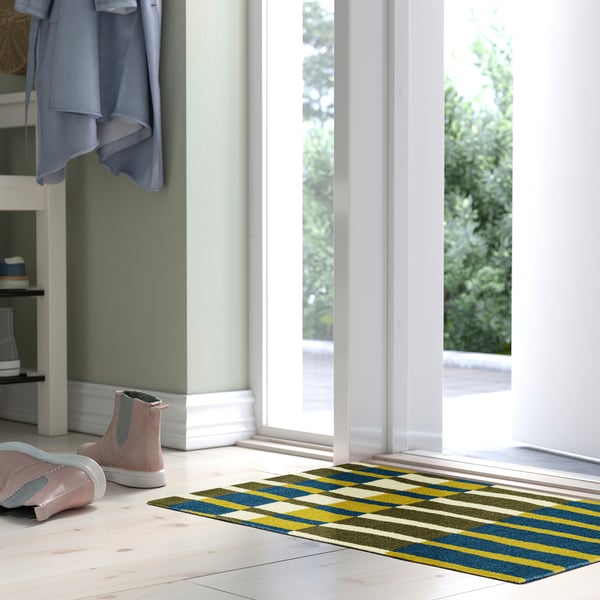 VALVBRO striped blue, yellow mat by door, pink boots, light floor.