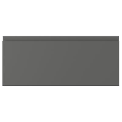 A modern, grey VÄSTERVIKEN cabinet front with an integrated handle, sleek design, and matte finish.