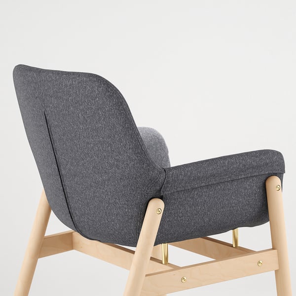 Modern upholstered chair with light wood legs, offering comfort and style. Perfect for dining or living spaces.