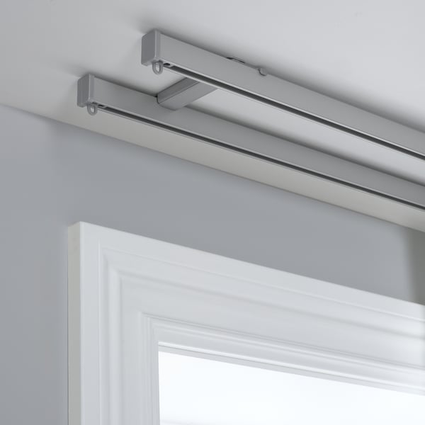 Image shows VIDGA ceiling brackets for dual curtain rails, offering light and privacy control.
