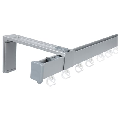 VIDGA silver curtain rail system with wall fitting and hooks.